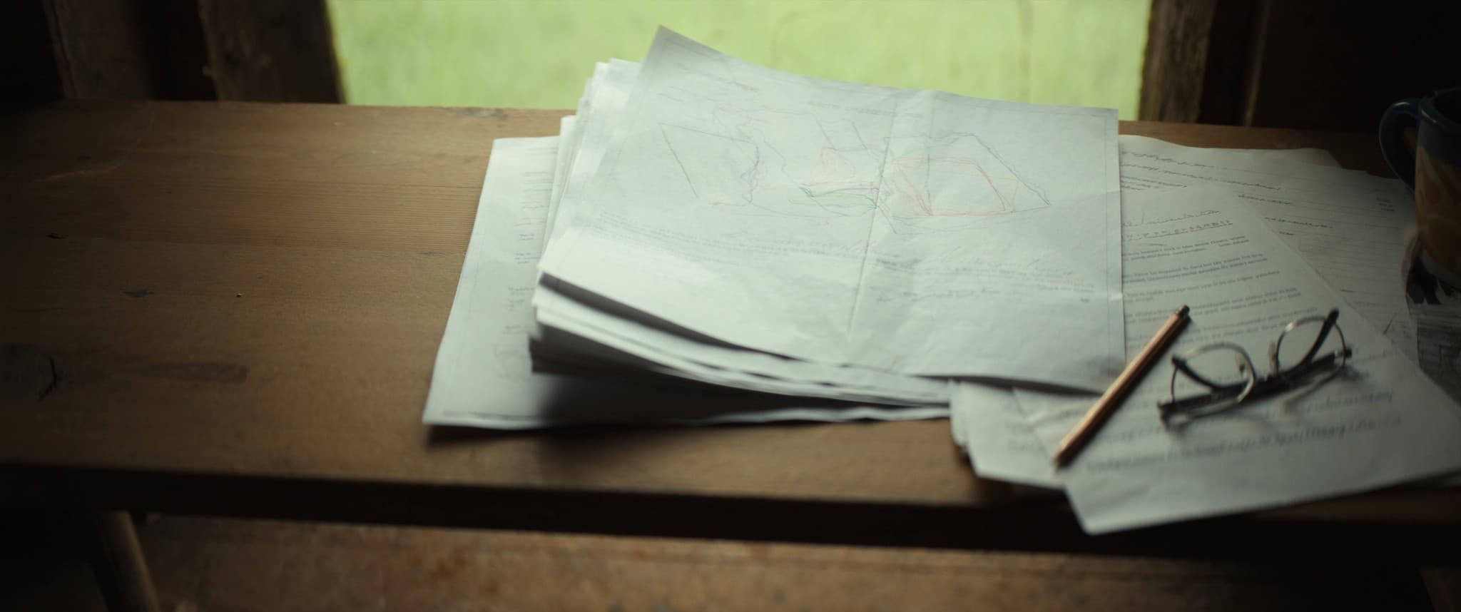A title plan and lease pages fanned out across a table.